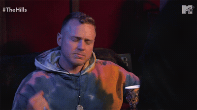 Man In Tie Dye Hoodie Watching Hills GIF