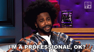 Man In Tie Dye Jacket Says I'm A Professional Ok GIF