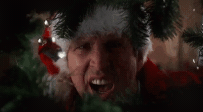 Man In Tie Dye Shirt Fixing Laptop GIF