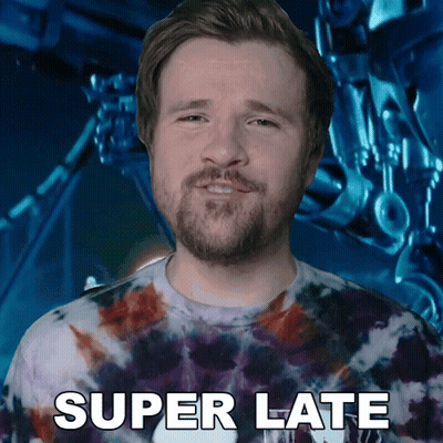 Man In Tie Dye Shirt Says Super Late To Robot GIF