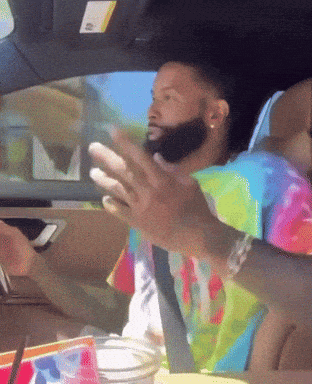 Man In Tie Dye Shirt Sitting In Car GIF