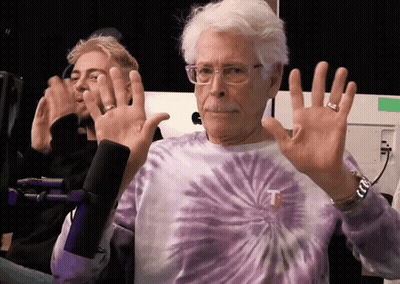 Man In Tie Dye Shirt With Letter T GIF