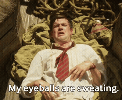 Man In Tie Laying Down Saying My Eyeballs Are Sweating GIF