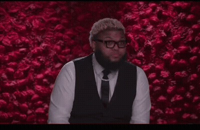 Man In Tie Sitting At Desk Mouth Open GIF