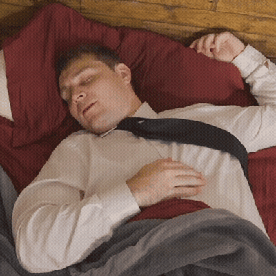 Man In Tie Sleeping In Bed GIF