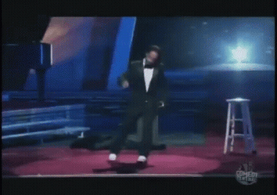 Man In Tie Standing Before Crowd GIF