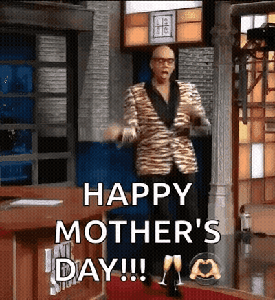 Man In Tiger Print Suit Dancing On Red Carpet Says Happy Mother's Day GIF