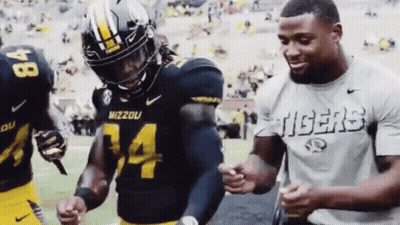Man In Tigers Shirt Next To Mizzou Football Player GIF