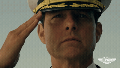 Man In Top Gun Hat Saluting Close Up GIF