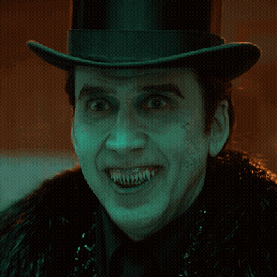 Man In Top Hat And Fur Coat With Painted Teeth GIF