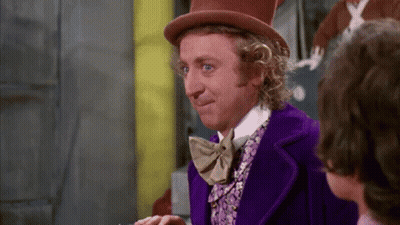 Man In Top Hat And Purple Suit Talking To Another Man GIF