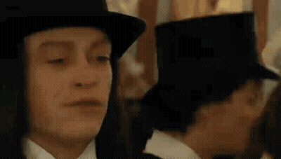 Man In Top Hat And Woman In Tuxedo GIF