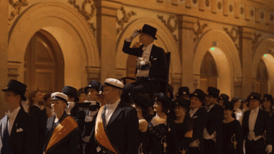 Man In Top Hat Holding Dog On Shoulders GIF