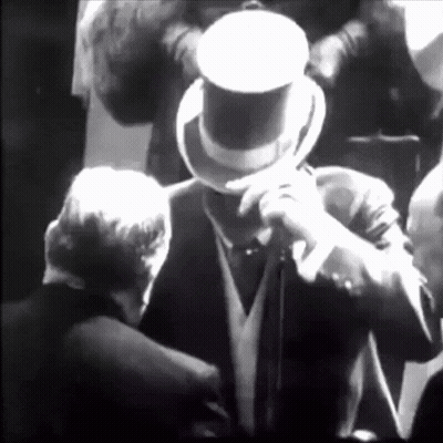 Man In Top Hat In Crowd GIF