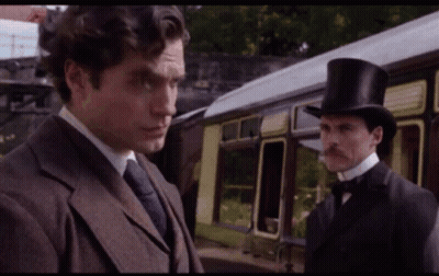 Man In Top Hat Next To Man In Suit GIF