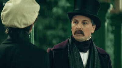 Man In Top Hat Says I'm Confused Talking To Another Man GIF