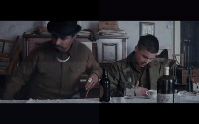 Man In Top Hat Sitting At Table With Alcohol GIF
