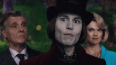 Man In Top Hat Smiling In Front Of Group GIF