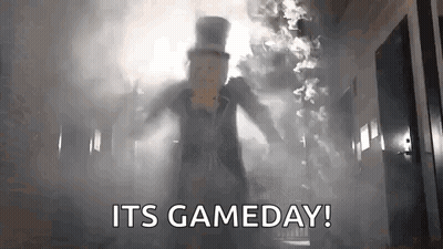 Man In Top Hat Standing In Hallway With Smoke GIF