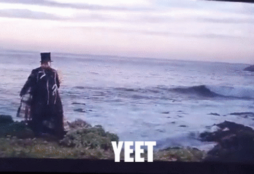 Man In Top Hat Standing Near Ocean Yeet GIF