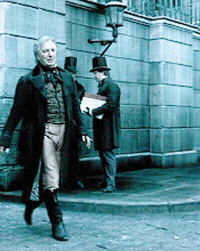 Man In Top Hat Walking Down Sidewalk GIF