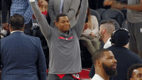 Man In Toronto Basketball Shirt Raising Arms GIF