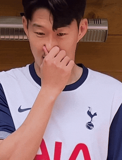 Man In Tottenham Jersey Covering Nose GIF