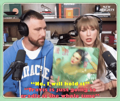 Man In Travis Hoodie Holding Woman Picture GIF