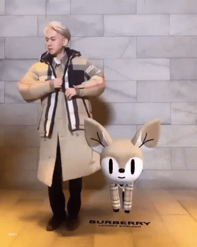 Man In Trench Coat And Cartoon Deer Burberry Store GIF