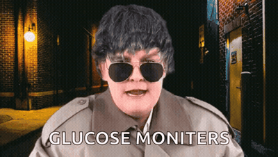 Man In Trench Coat And Sunglasses Says Glucose Monitors GIF