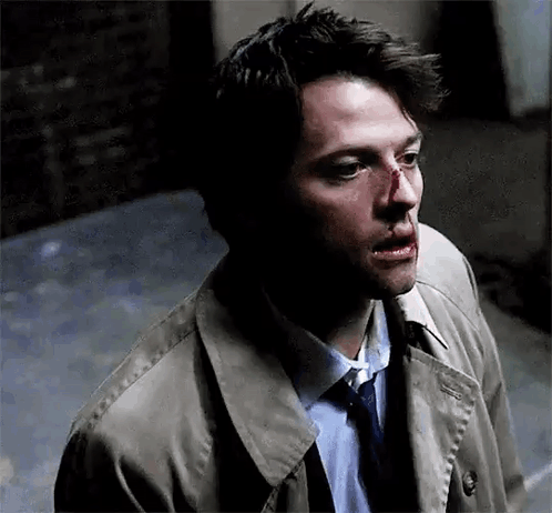 Man In Trench Coat And Tie With Bloody Nose GIF