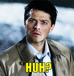 Man In Trench Coat And Tie With Huh On Face GIF