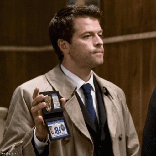 Man In Trench Coat Holding FBI Badge GIF