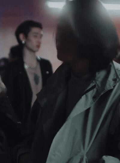 Man In Trench Coat In Crowd GIF