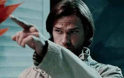 Man In Trench Coat Pointing GIF