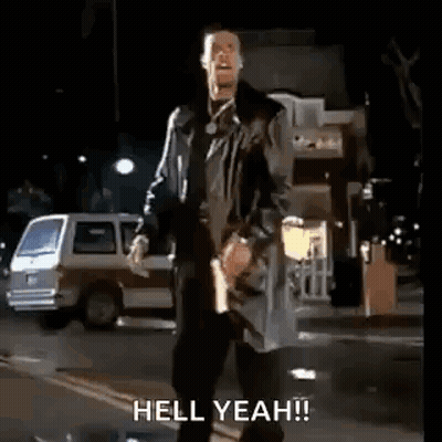 Man In Trench Coat Walking Night Street GIF