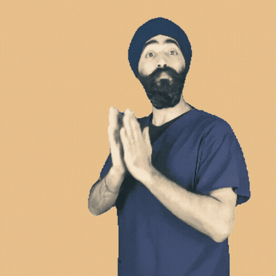 Man in Turban and Blue Shirt Praying