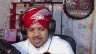 Man In Turban And Headphones At Computer GIF