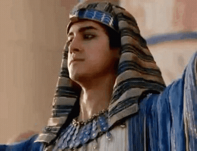 Man In Turban And Necklace With Arms Outstretched GIF