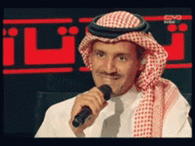Man In Turban Holding Microphone GIF