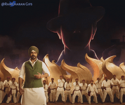 Man In Turban In Front Of Men In White Pants GIF