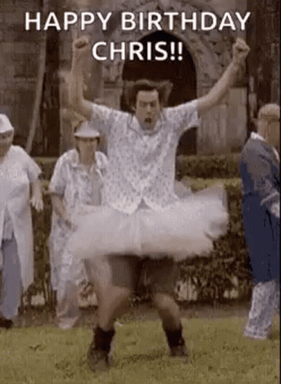 Man In Tutu Dancing In Field With Group GIF