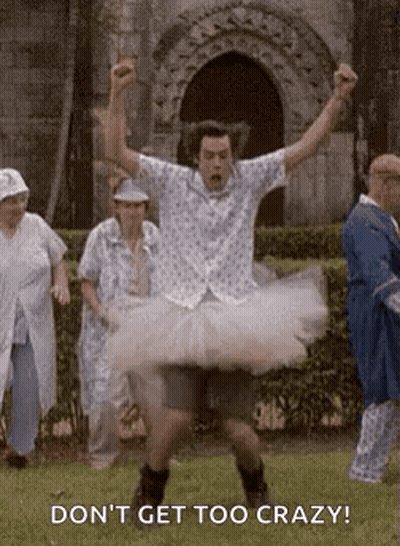 Man In Tutu Jumping While People Watch GIF