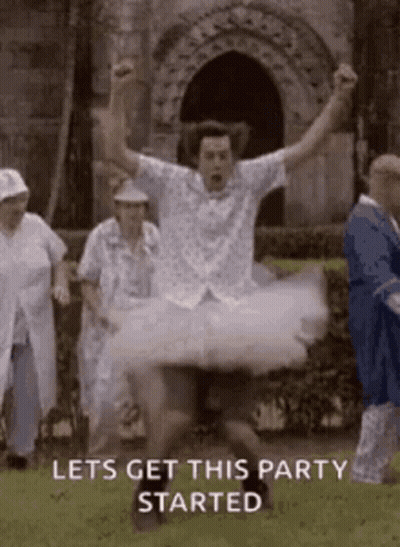 Man In Tutu Jumping With Arms In Air GIF