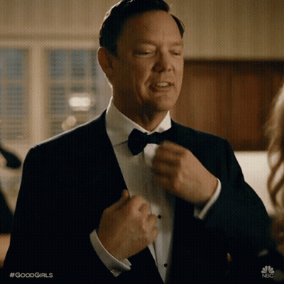Man In Tuxedo Adjusting Bow Tie GIF