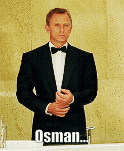 Man In Tuxedo And Bow Tie At Sink With Word Osman GIF