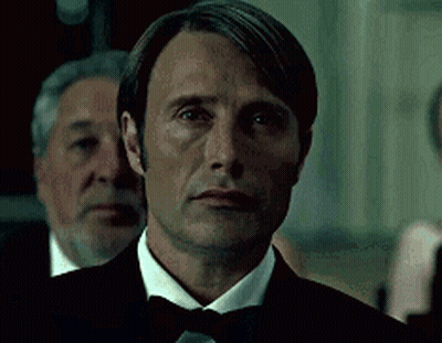 Man In Tuxedo And Bow Tie Looking At Camera GIF