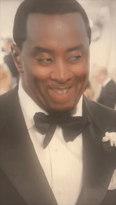 Man In Tuxedo And Bow Tie Looking GIF