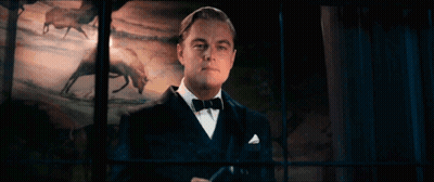 Man in Tuxedo and Bow Tie Looking Out Window