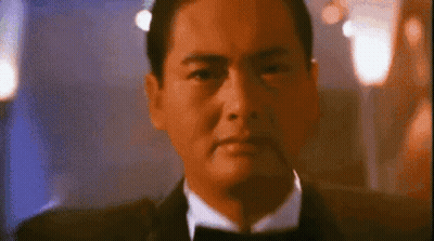 Man In Tuxedo And Bow Tie Looking Serious GIF